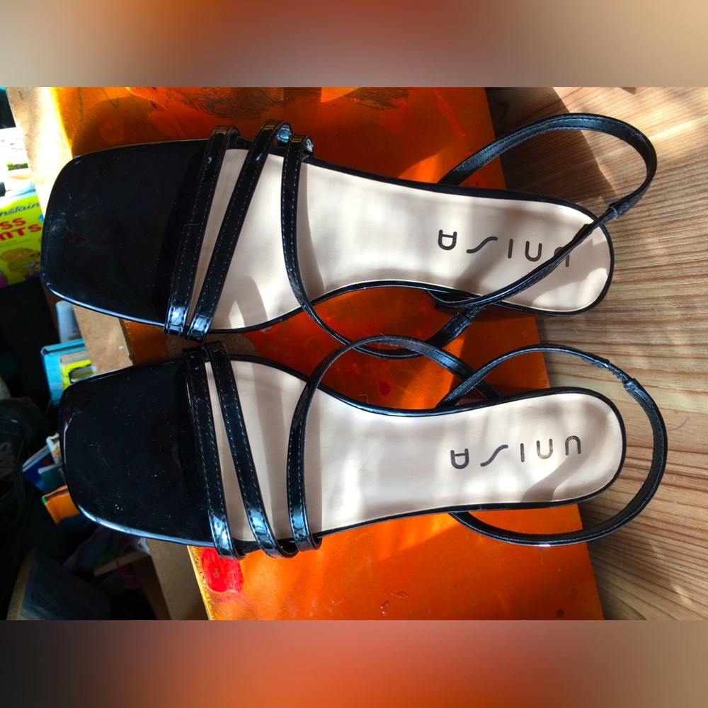 Black strappy heals.